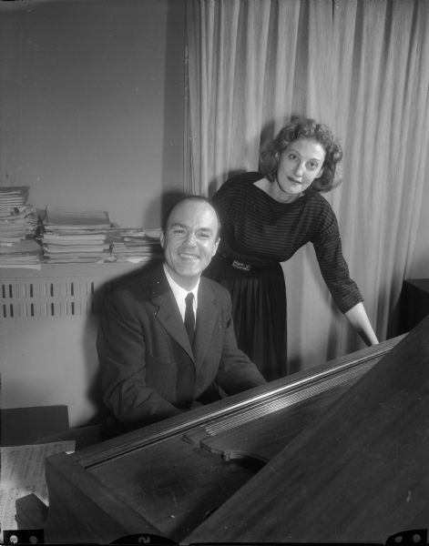 Mr. and Mrs. Frank Amey, of Stanford, Connecticut, pictured in the home of George and Margaret Hanson, 1102 Lincoln Street. The Ameys are brother-in-law and sister of George Hanson. Mr. Amey, a concert pianist, gave a concert on December 6 in Madison.