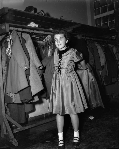 A Shorewood schoolgirl puts on her coat following dancing class.