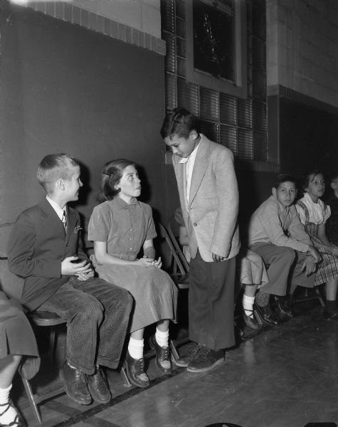 A boy asks a girl for a dance at a Shorewood School dancing class.