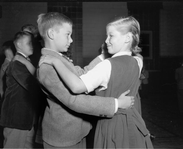 A boy and girl demonstrate dancing technique at a Shorewood School dancing class.