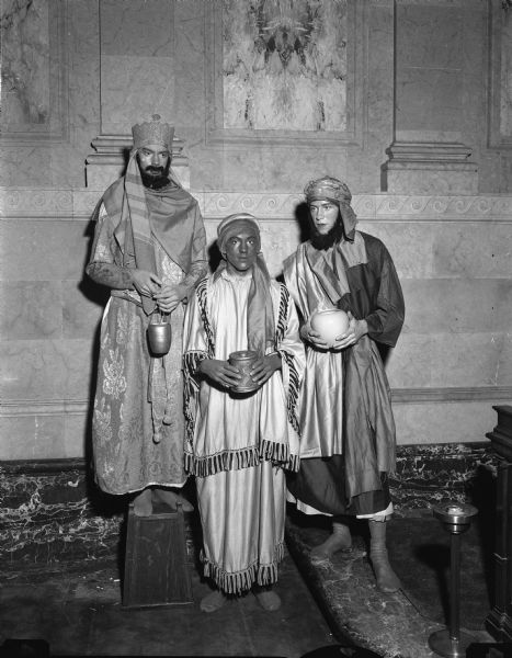 Three boys dressed as wise men posed in the Wisconsin State Capitol.