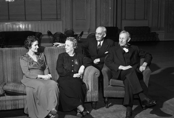 Frances Kivlin and Fanny Steve seated with their husbands Vincent Kivlin, Professor of Agricultural Education, and William F. Steve, Emeritus Professor of Physics, at a University of Wisconsin University League dance at the Memorial Union.