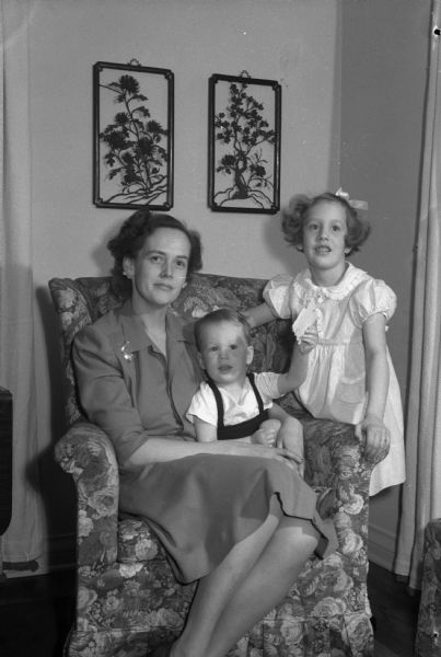 Janey Rikkers with children, Betty and Frederick. Frederick is holding a valentine. The children's father is Edward H. Rikkers.