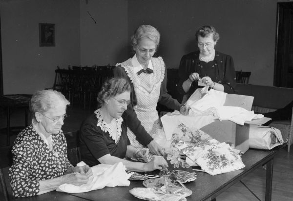 Red Cross volunteers from Christ Presbyterian Church working on "scruffies" for hospitalized soldiers at Truax Field. Left to right are Mrs. H.L. Yeager, Ruby Bancroft, co-chair, Lydia Wilcox, and Myrta Fosnot.