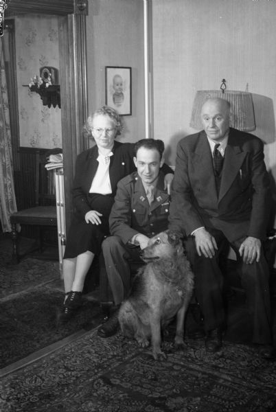 Greg and Lucille McCormick(?), 2002 Yahara Place, with thier son Patrick(?), in military uniform, and a dog.