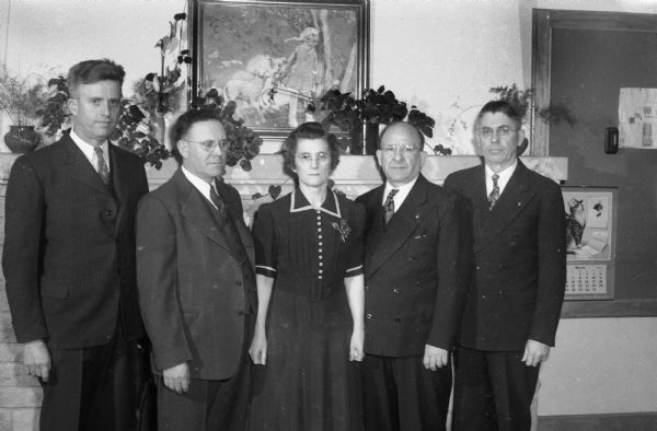 Five employees of Columbus Foods Corporation, who have been with the firm for 30 years or more, received "A" achievement award pins for food production and canning at Columbus.  Left to right are:  Harmie A. Welk, assistant secretary and treasurer; Will J. Evans, fieldman; Arthur Alff, electrician; Frank Yuds, machinist; and L.G. Richards, assistant factory superintendent.
