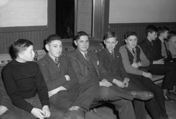 Five boys in "stag line" at Cottage Grove Youth Club event in the Town Hall. Left to right are: Rowley Conant, Nora School; Rolly Gausmann, Cottage Grove School; Reuben Birrenkott, Cottage Grove School; Donovan Chandler, East High School, Madison; and Philip Gausmann, Hope School.