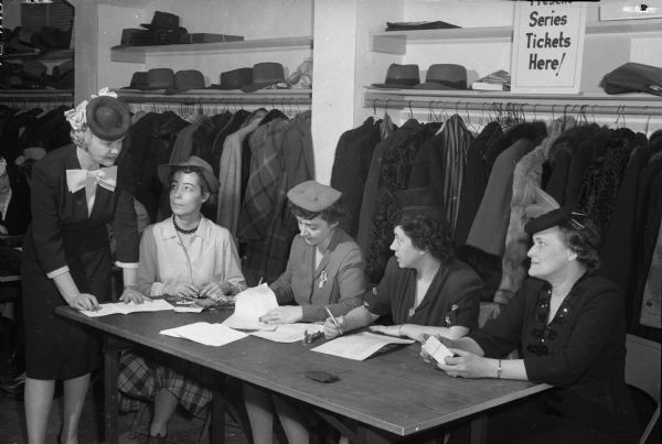 League of Women Voters dinner ticket committee. Standing at left is Mary Rennebohm, and seated left to right are: Harriet J. Morris, Caryl A. Regan, Lucille O'Keefe, and Helga Kittleson.