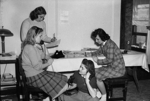 Four women campaign workers for Republican Presidential Candidate Harold E. Stassen sitting around a table.
