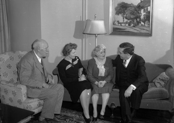 Governor Walter Goodland, Mrs. Willkie, Madge Goodland, and Wendell Willkie chatting in the governor's residence during the 1944 campaign.