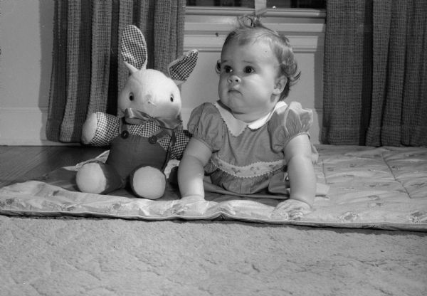 Cynthia Scott Harley, nine-months-old, with stuffed rabbit.