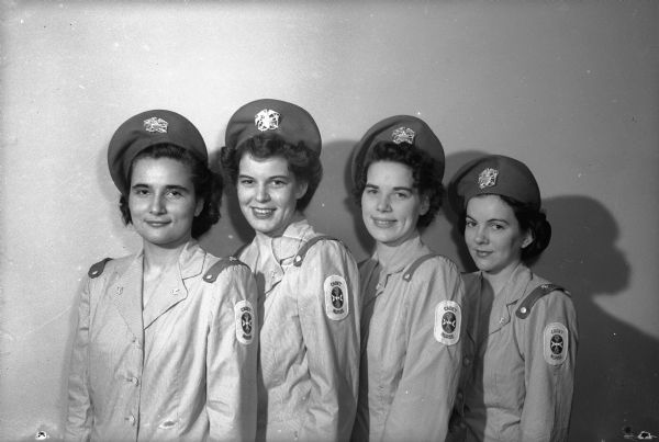 Four student nurses from four schools of nursing, model the new summer uniform of the United States Cadet Nurse Corps. L to R: Jean Kolb, Gertrude Anderson, Clarice Brownrigg, and Marilyn Stahlnecker.  The U.S. Cadet Nurse Corps is a training program sponsored by the government to produce more nurses.  The student nurses are obligated to stay in nursing, either military or civilian, until the end of World War II.
