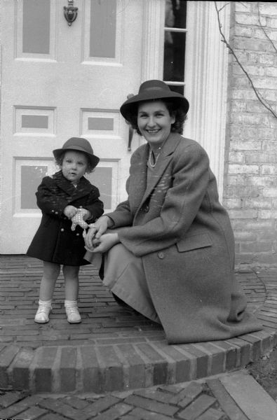 Edna Krieger and daughter Nancy, posing on the steps of 2404 Kendall Avenue.