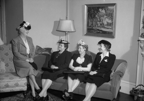 Silver tea, benefiting the YWCA at the Governor's residence, 130 E. Gilman Street. Shown seated are Mae Loeffelbein, Anna Johnson, Madeleine Johnson, and Hattie Swan.