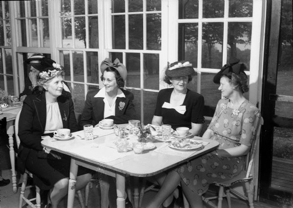 Shorewood Hills League members attending luncheon at the Blackhawk Country Club, Mrs. T.W. Doig (Beulah Doig), Mrs. Sydney Miller (Myrtle Miller), Mrs. Arch Ely (Marie Ely), and Mrs. Ralph A. McCanse, who has served as president of the League during the past year.