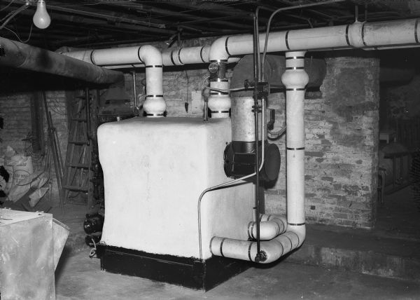 Boiler installed by A.M. Toussaint Heating Company, 204 Winnebago Street, at the German House, 508 North Francis Street.