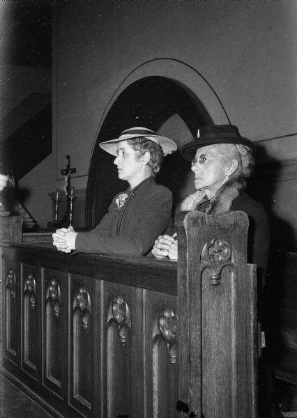 Adelaide and Mrs. August Knoche (Lucille Knoche), mother and daughter, praying at Holy Redeemer Catholic, 128 W. Johnson Street, for the soldiers in Europe for the D-Day Invasion.