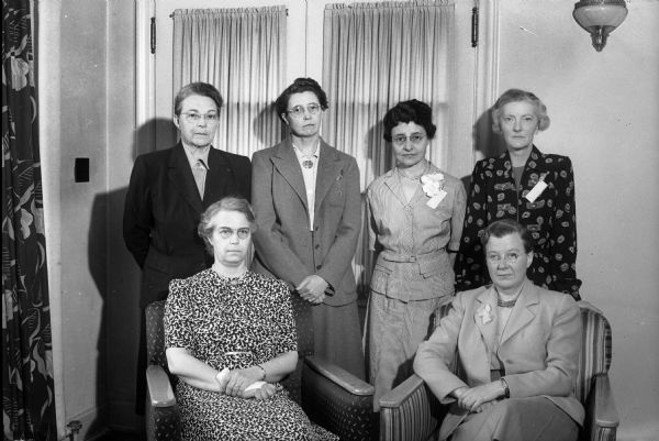 Group portrait of six women officers of Alpha Epsilon Iota medical fraternity for women. Seated are: Dr. Helen A. Cary on the left and Dr. Annette Washburne on the right; and standing left to right: Dr. Luvia Willard, Dr. Mabel Masten, Dr. Ruth Stelle, and Dr. Mary E. Mathes.