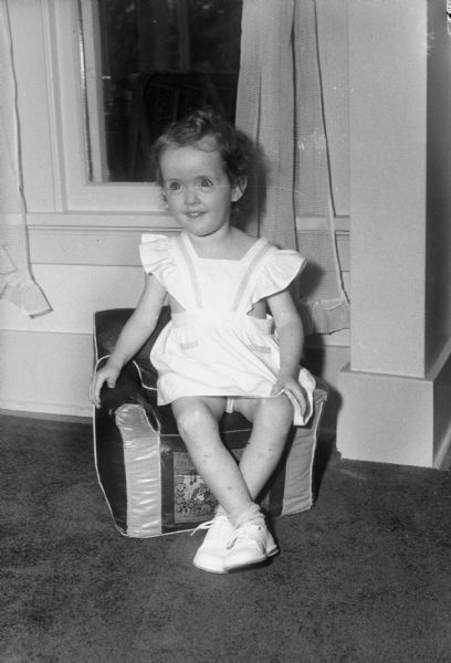 Sarah Lee Makin, daughter of John C. Makin, Route 4, seated on a chair.