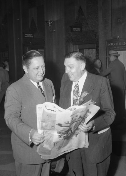 Two Wisconsin delegates to the Republican Party National Convention held in Chicago, Illinois. Looking at a newspaper, left to right: Cyrus Philipp, Milwaukee, and Assemblyman Julius Spearbraker, Clintonville.

