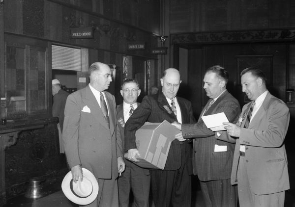 Five Wisconsin delegates to the Republican Party National Convention held in Chicago, Illinois. Photographed at the Hotel Bismark left to right: Arthur L. May, Madison, Chief Clerk State Assembly; Norris Kellman, Galesville, Assembly Sergeant; Reverend George Cady, Kenosha; State Senator Bernhard Gettelman, Milwaukee, and Assemblyman Donald McDowell, Soldier's Grove.