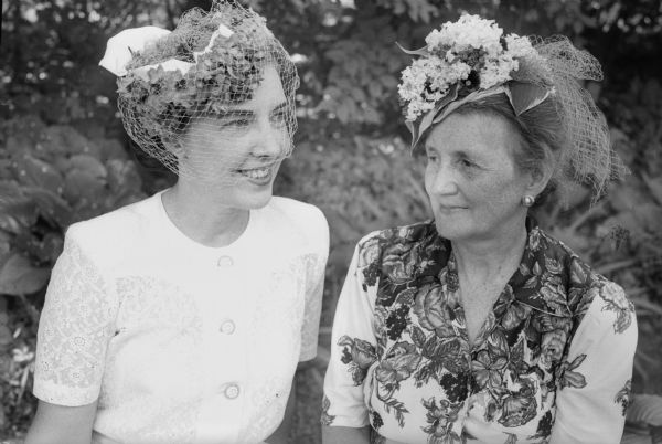 Two members of the West Side Garden Club wearing hats created from vegetable material. From left: Mrs. Henry A. Pochmann (Ruth) and Mrs. R.A. (Mary) Walker.