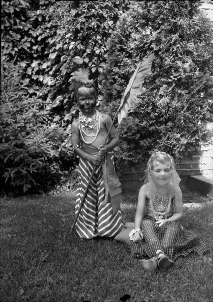 A girl and boy in costume for a Fourth of July parade in the Westmoorland neighborhood. From left to right are Thomas Hammill, son of Mr. and Mrs. William Hammill, and Gretchen Ulrich, daughter of Mr. and Mrs. William Ulrich.