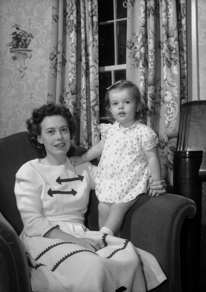Mrs. Robert (Eleanor) Randle and her daughter, Penelope, at the home of her parents, where they were living while Captain Randle was stationed in England.