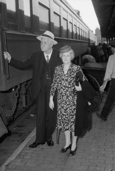 Governor Walter Goodland and Mrs. Goodland board the train for the Republican Governors conference in St. Louis. The meeting was called by Thomas E. Dewey, governor of New York, and Governor John W. Bricker, Ohio, nominees for the presidency and vice-presidency.