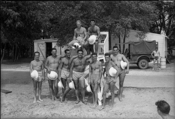 Truax cadets serving as lifeguards while swimming at Warner Beach. Left to right, standing: Karl Peters, George Toothill, John Fink, Norman Finazzo, John Ord, Lester Guinter, and Frank Sunday. Sitting above are: Hoy Stone, Johnny Fero.
