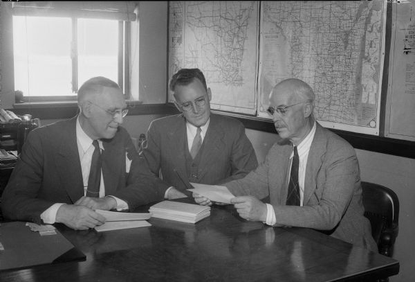 James R. Law, chairman of the Dane County Chapter of the National Foundation for Infantile Paralysis, Palmer F. Daugs, Lake Mills, representative of the National Foundation for Infantile Paralysis, and Dr. F.F. Bowman, city health officer, are compiling a record of all infantile paralysis victims in the area in order to provide better services for them. Dane County has had 96 cases of polio since 1930.