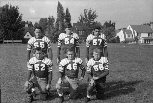 Group portrait of six West High School football players: 55 Henry Heirlmeier; 56 Max Cichon; 57 Gil Coluccy; 46 Dave Neupert; 54 Bob Mansfield; 52 Bill Piper.