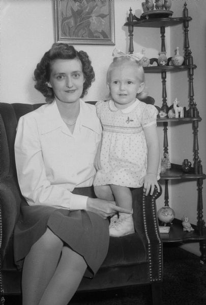 Mrs. Roger O. Hornig (Portia Stone), holding daughter Pamela. Mrs. Horning and her daughter are staying with her mother, Mrs. Charles H. Stone, at Kennedy Manor, while her husband, Tech. Sgt. Roger O. Hornig, is stationed at Texarkana, Texas.