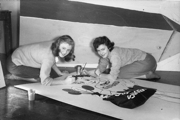 Betty Lou Borenson and Cynthia Alexander preparing University of Wisconsin-Madison Homecoming decorations in the Memorial Union student workshop.