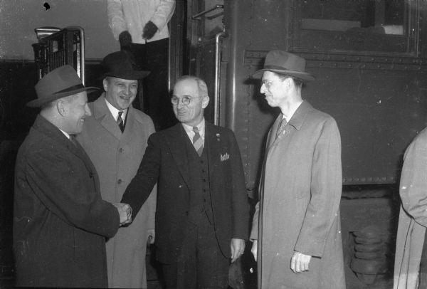 Democratic candidate for vice-president, Senator Harry S. Truman of Missouri, being greeted by Madison labor leaders. From left: Roy E. Bewick, President of Madison Federation of Labor; Clifford Johnson, CIO representative; and George McD. Schlotthauer, Democratic candidate for the State Senate.
