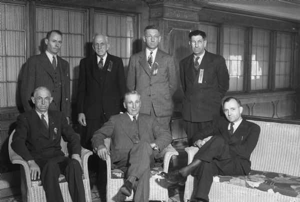Group portrait of 7 men, probably the executive committee, members of the Wisconsin Council of Agriculture: in no particular order, they probably are: C.F. Claflin, Pres., Charles F. Dineen, Fred W. Huntzicker, Bryce S. Landt, Walter Hardiman, Melvin O. Mason and Milo K. Swanton.