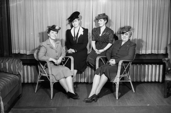 Group portrait of four members of the Zonta International Club, a classified service club for executive women, taken at an inter-city meeting held at the College Club. From left to right: Lucile Clock, Madison chapter; Mrs. Edna H. Gillette, secetary of the club; Dr. Marvina Wilson, vice-president of the Madison chapter; and Meta M. Steinfort, Milwaukee, chairman of Region B., District 2.