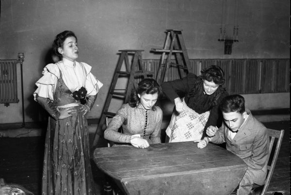 West High School student production of "Our Town" showing a family scene at breakfast, left to right: Mary Snee, Virginia Baldwin, Barbara Burrell, and Erwin Davis.