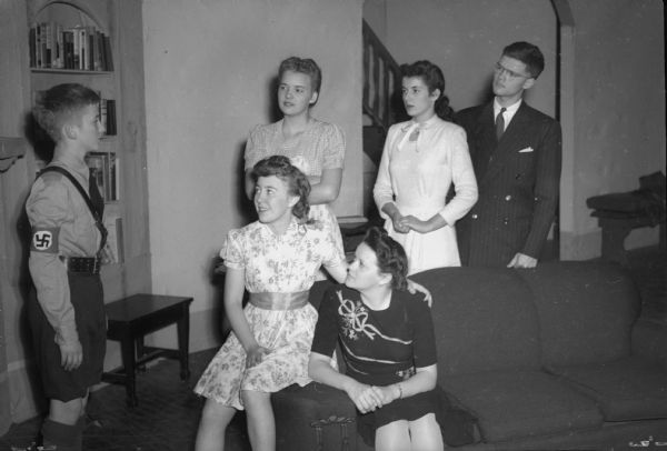 Members of the East High School play cast for "Tomorrow the World" a story of a Nazi boy in the United States, standing left to right: Robert Cnare, the German boy; Ina Erickson, Patty Hubin, Robert Lunder, seated: left, Arlene Whitefoot, and Dorothy Schultz.