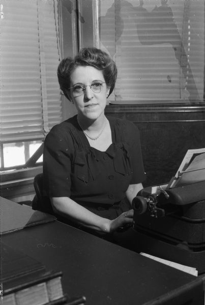 Secretary Ona Sanford in her office. Ona handles all of the correspondence for Wittwer and Webster, Inc., insurance agency.