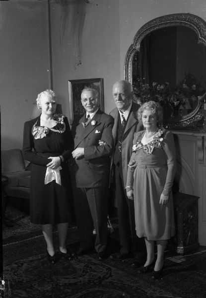 Receiving their guests at the Executive residence, 130 E. Gilman Street, are (left to right): Mrs. (Mary) Oscar Rennebohm, Lieut. Governor, Oscar Rennebohm, Governor Walter Goodland, and Mrs. (Madge) Walter Goodland. This reception followed the inauguration of the State of Wisconsin officers.