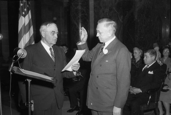Lieutenant Governor Oscar Rennebohm being sworn in by Chief Justice Marvin B. Rosenberry.