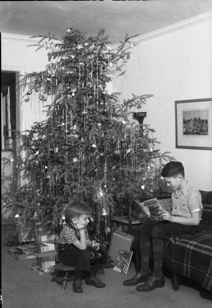 Two children in front of a Christmas tree in the Radke home.