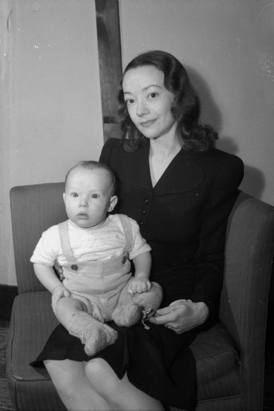 Mrs. Ernest W. Sullivan (Orpha Basham) and her infant son, Ernest Jr., "Skippy," who were making their home with Sgt. Sullivan's parents, Dr. and Mrs. Walter E. Sullivan, Shorewood Hills, while Sgt. Sullivan is serving with the Armed Forces in North Africa.