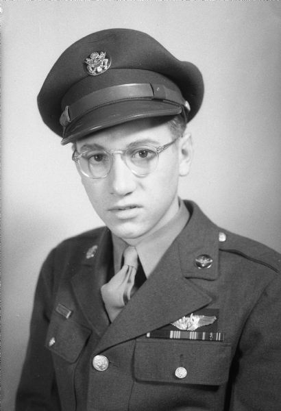 Man in Air Force uniform wearing eyeglasses.