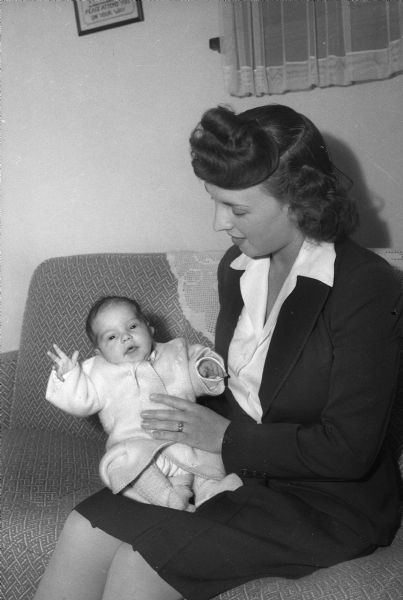 Mrs. Herman Paul Clark (Hazel Margaret Smith) and her infant son, Herman D. Clark. Her husband is in the United States Army, World War II.
