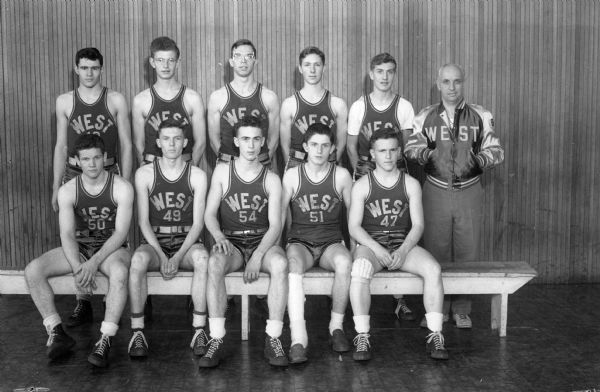 The West High Basketball Team, winners of their last nine games, (Regents). Pictured left to right: (standing) Bob Smith, Jack Wise, Don Page, Bob Worthman, and Doug Rippe, and Coach Willis Jones; seated left to right: Tom Callen, John Berger, Jim Zimmerman, Ray Lenahan, and Ed Gibson.