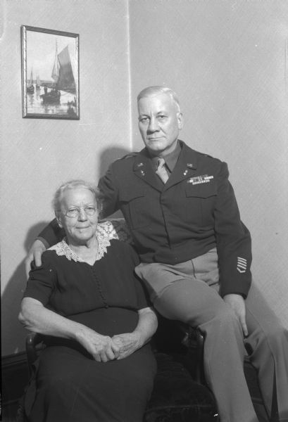 Portrait of Colonel LLoyd M. Garner with his mother, Mrs. Sarah A. Garner, 1633 Jefferson Street.  Colonel Garner lives in Baltimore, Maryland, and is a veteran of the North African and Italian invasion during World War II.
