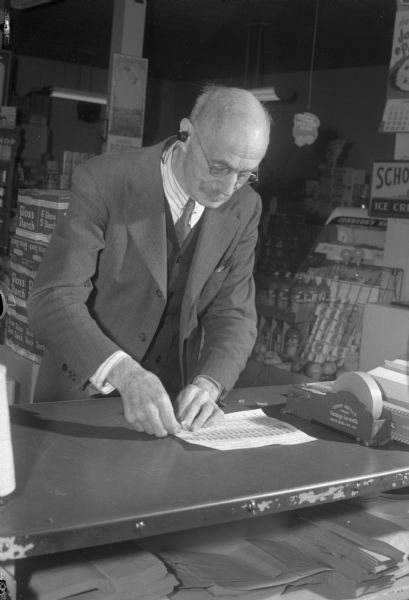 Portrait of Henry J. Napper, 2127 Kendall Avenue, in his grocery store at 2532 Monroe Street. Mr. Napper, who has been in the grocery business for 50 years, is marking his 80th birthday.