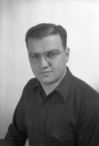 Informal portrait of Joe D. with open shirt collar.